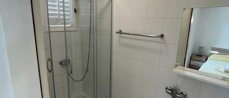 Shower, towels, soap, toilet paper