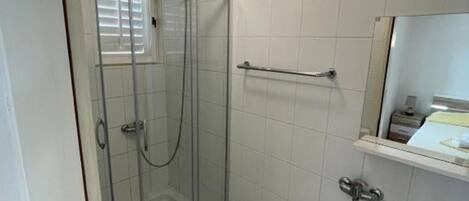 Shower, towels, soap, toilet paper