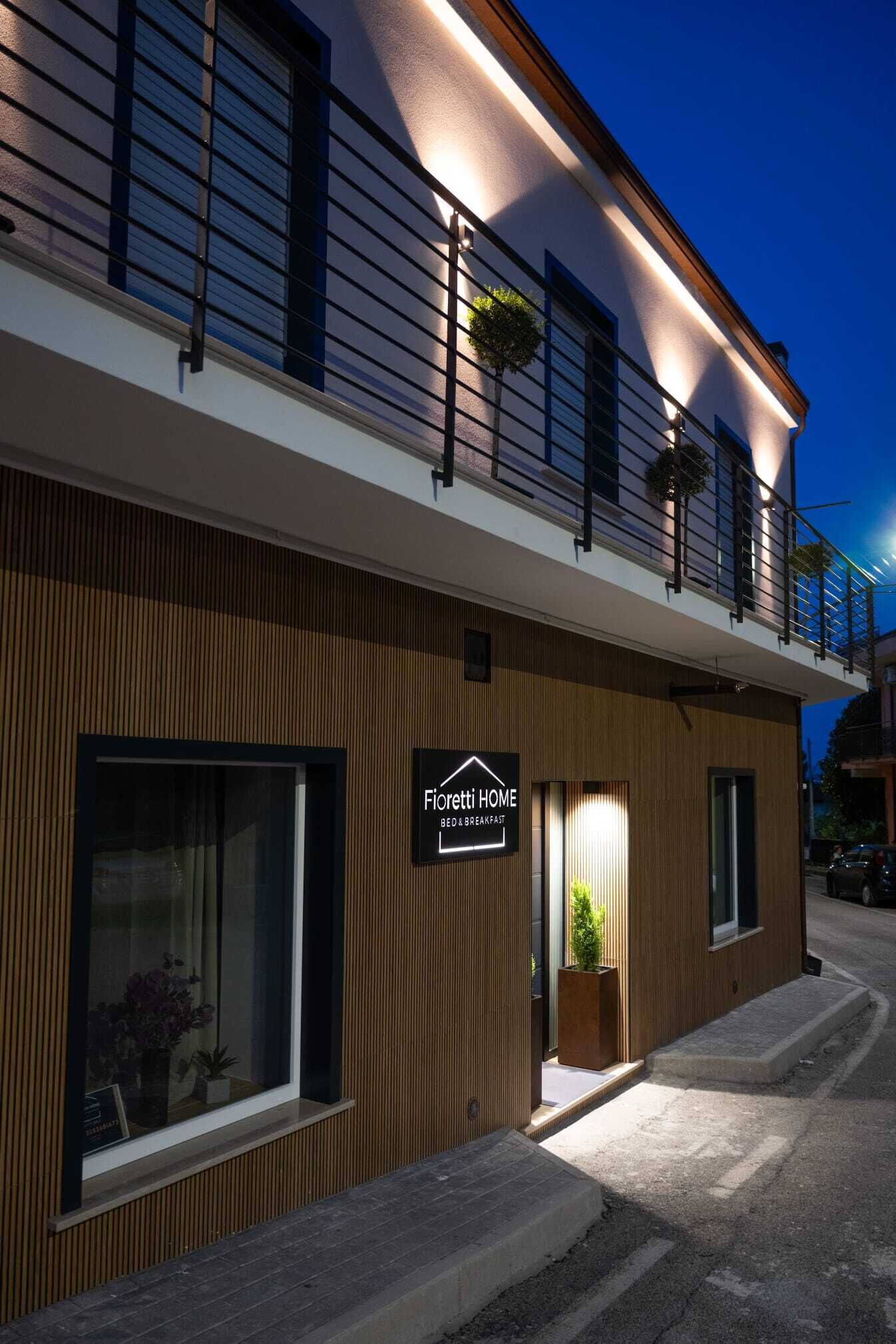 A modern building with a sign reading 'Fioriitti HOME'.