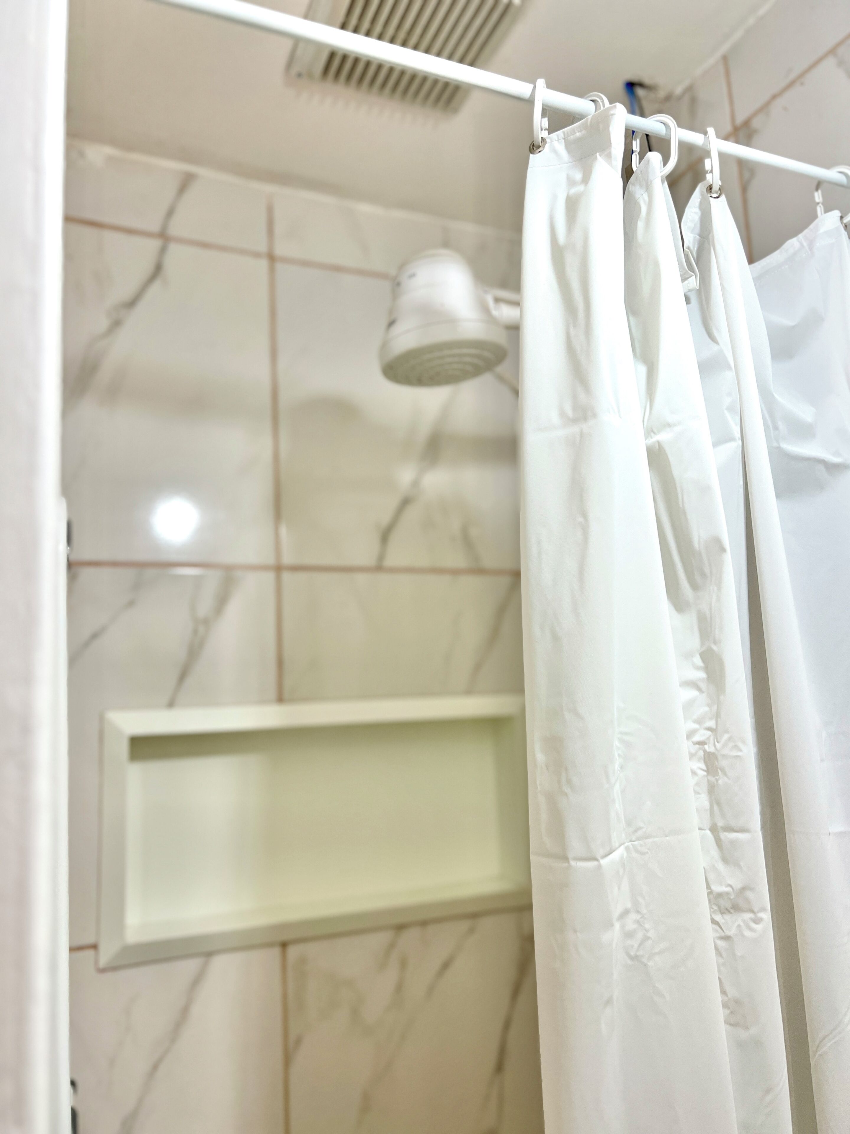 Shower, towels, soap, toilet paper