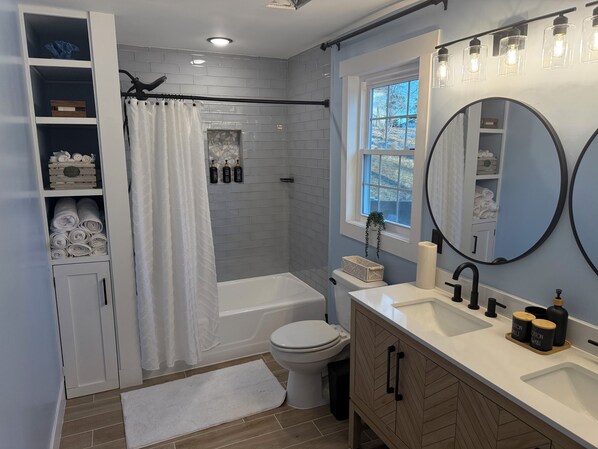 Shower, hair dryer, towels, soap