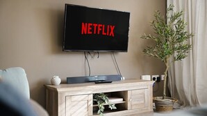 A television mounted on a wall with a plant beside it. - 3 Bedroom with Parking, Close to Town Centre (Redcar and Cleveland)