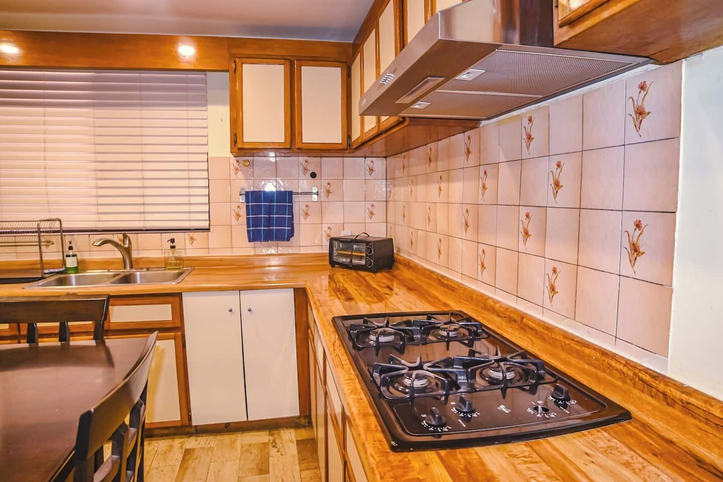 Gas stove with a large countertop, perfect for cooking with ease.