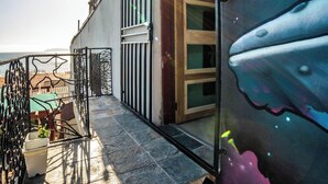 Exterior detail - Cozy studio 3 blocks from the beach in San Antonio del Mar. Enjoy a private rooftop terrace with our signature galactic whale mural, community pools & tennis courts, and a secure 24/7 gated community. Perfect for couples or small groups. (San Antonio del Mar)