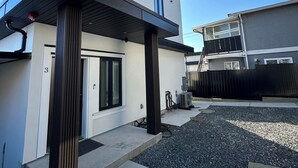 A modern two-story house with a flat roof, large windows, and a visible number '3' on the side. - BRAND NEW MODERN 3BR LANEWAY HOUSE (Vancouver)
