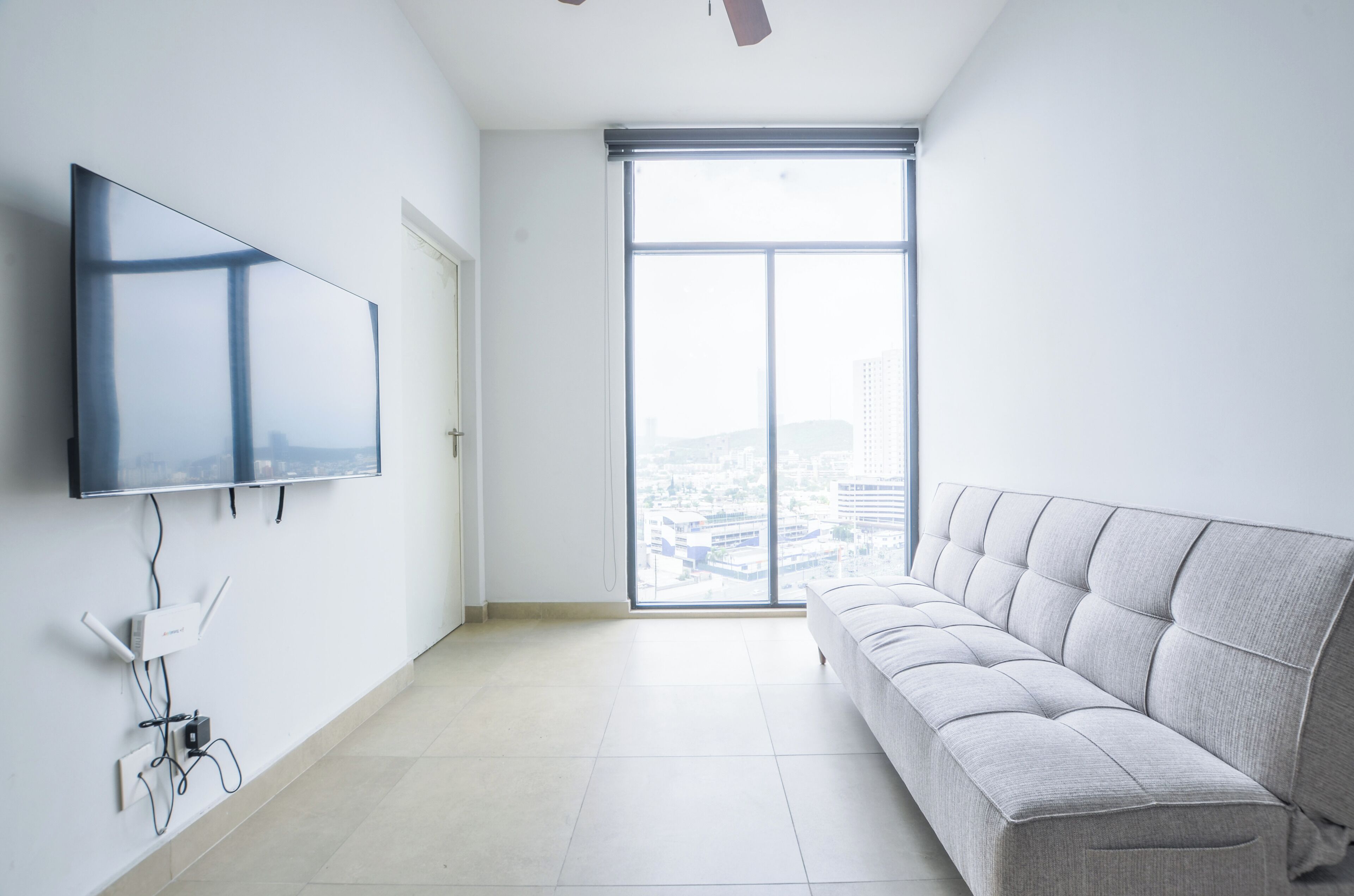 Suite Confort, balcón, vista a la ciudad | Área de sala de estar