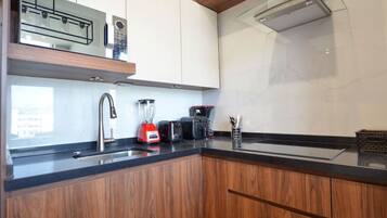 Fridge, microwave, stovetop, coffee/tea maker