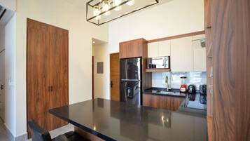 Fridge, microwave, stovetop, coffee/tea maker