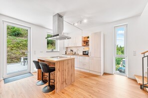 Apartamento superior, vistas al jardín | Cocina privada