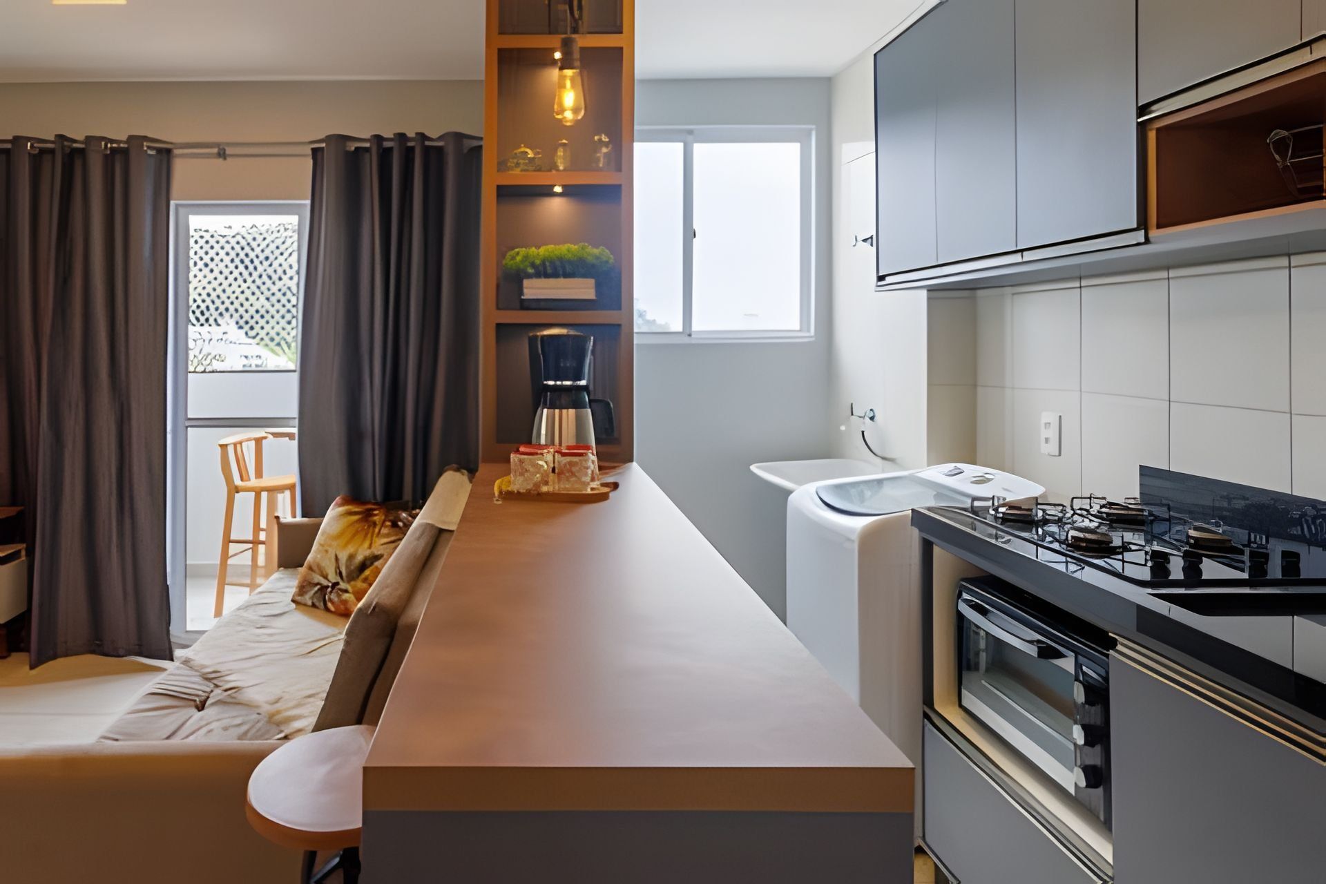 A modern kitchen with a built-in stove, a coffee maker, and a sink.
