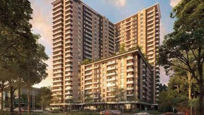 Un edificio residencial alto con varios balcones, rodeado de árboles y un cielo despejado.