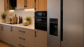 Superior Suite, Balcony, Sea View | Private kitchen | Coffee/tea maker, electric kettle, dining table
