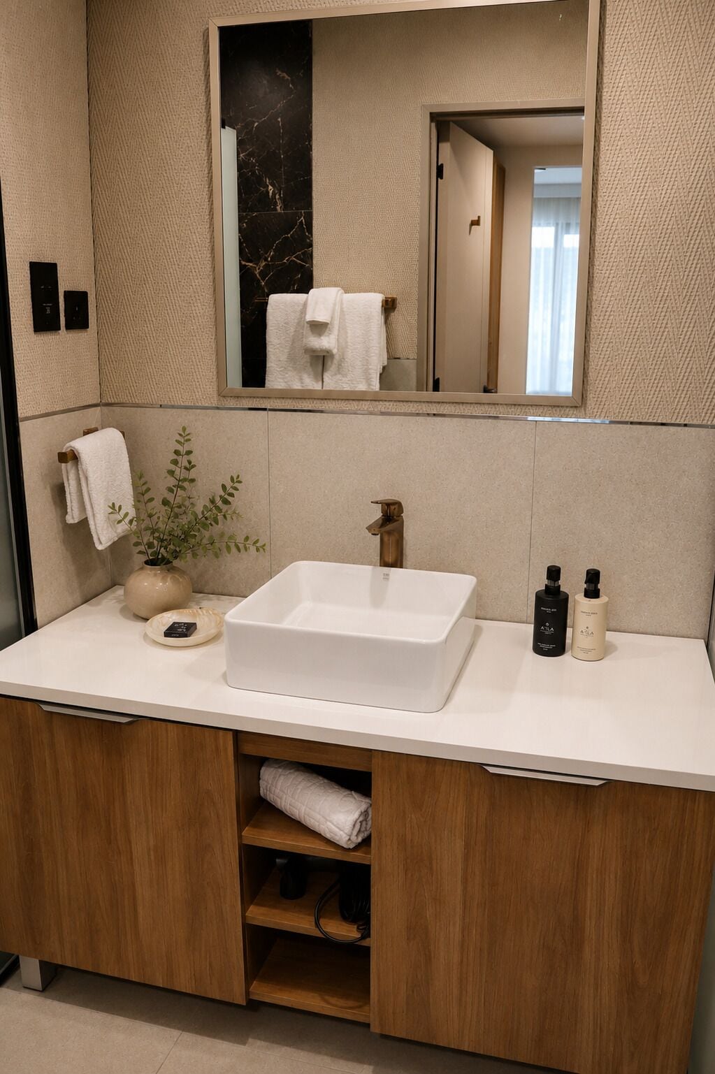 A modern bathroom with a large rectangular sink, a mirror above it, and a wooden cabinet below.