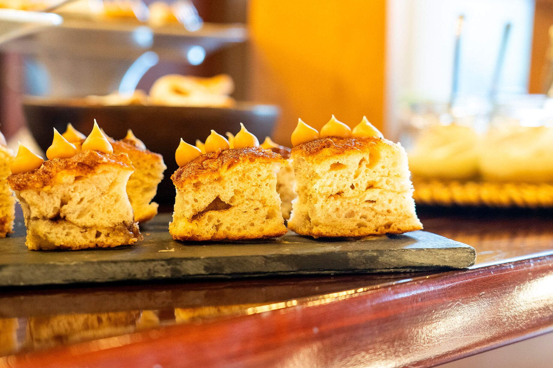 A selection of pastries on a slate serving board.