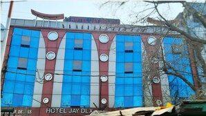 A building with a sign reading "HOTEL JAY DLGX". - Hotel Jay Deluxe (Sasaram)