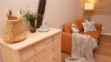 Deluxe-Dreibettzimmer | Wohnbereich