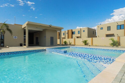 Cozy 3-bedroom/ bathroom house in Portmore with AC, pool, and gym access