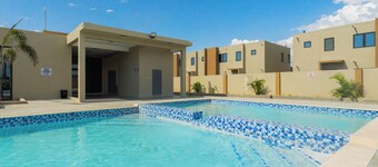 Cozy 3-bedroom/ bathroom house in Portmore with AC, pool, and gym access