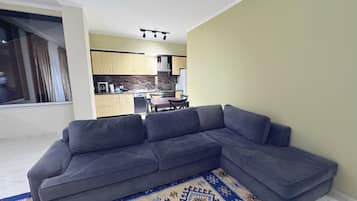 Family Apartment, Balcony, Park View | Living area | Flat-screen TV
