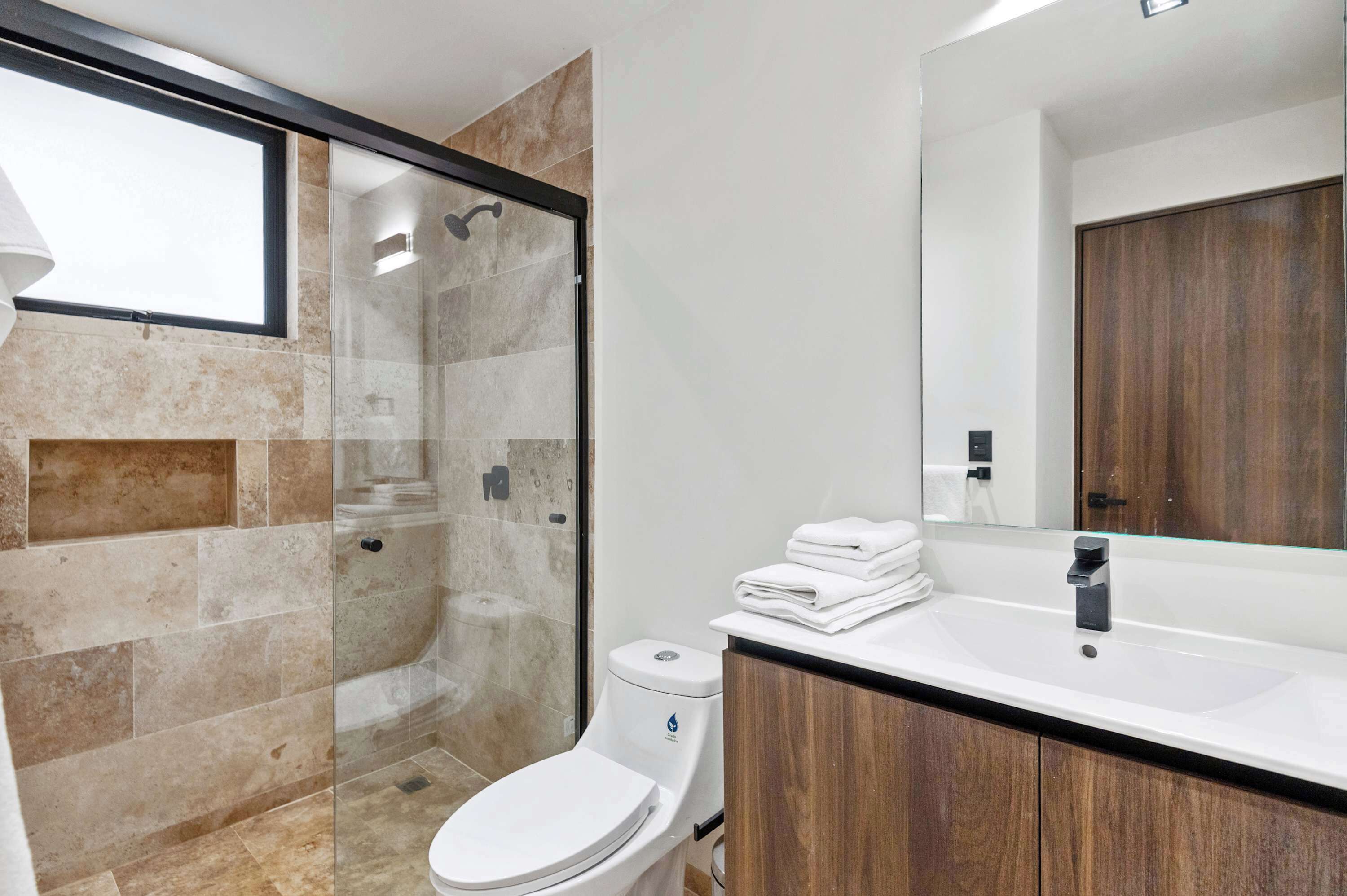 Shower, hair dryer, towels, shampoo