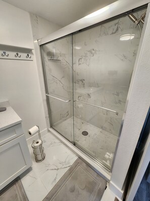 Shower, hair dryer, towels, soap