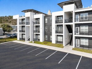 A multi-story parking garage with clearly marked parking spaces. - Stylish 1st-Floor Suite Near Convention Center (Hot Springs)