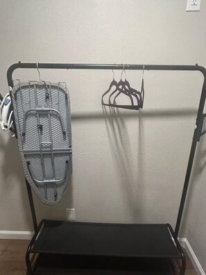 A metal rack with a mesh basket and a flat shelf. - The Orange Sunset (Cleveland)