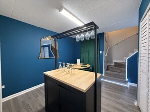 A bathroom with a wooden vanity, a mirror, and a towel rack. - Grand Teal Dynasty•Pool•Fireplace•Clean (Gulfport)