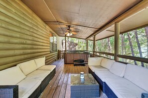 A log cabin with a covered porch, wooden flooring, and a hot tub. - Free Dollywood, Hot Tub, Firepit, Pool Table, Spa (Gatlinburg)