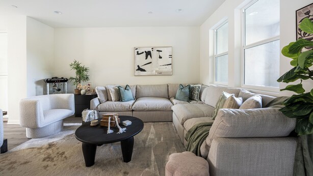 A living room with a sectional sofa, a coffee table, and a large window. - Cozy Stay Near San Diego With 2 Car Garage (Lemon Grove)