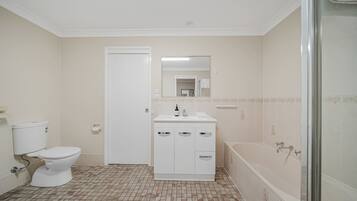 Shower, hair dryer, towels, shampoo