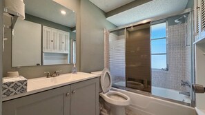 A bathroom with a toilet, sink, and shower. - Sunny Siesta Key Retreat w/ Private Heated Pool | 2BR | Dog-Friendly (Siesta Key)