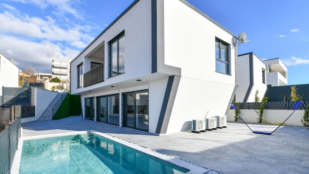 A modern two-story house with a swimming pool, large windows, and a satellite dish. - Pet friendly home in Jadranovo with sauna (Jadranovo)