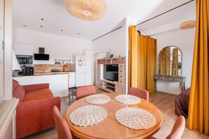 A modern apartment with a kitchen, dining area, and living space. - AS27106-P2 ground floor, pool parking, air conditioning and wifi (LE GRAU DU ROI)