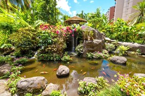 A tropical garden with a waterfall, koi fish, and a gazebo. - Kaanapali Shores | Ocean View 4 BR, Sleeps 12 | Car Incl. w/ 6+ Nights | KS ML-3677 by KBM (Lahaina)