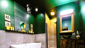 A modern bathroom with a freestanding bathtub, a glass-enclosed shower, and a vanity with a mirror. - Asian Zen With Jacuzzi, Kitchenette, Near Victoria Sq (Sparks)