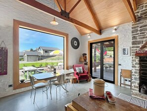 TV, fireplace - The Shed: Rustic Retreat with Modern Comfort (Queenstown)