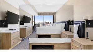 A hotel room with a bed, bedside tables, a flat-screen TV, and a city view. - Hilton Grand Vacations Club Elara Center Strip Las Vegas
1-bedroom suite (Las Vegas)