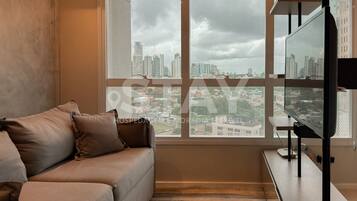 Apartamento Deluxe, vistas a la ciudad | Zona de estar