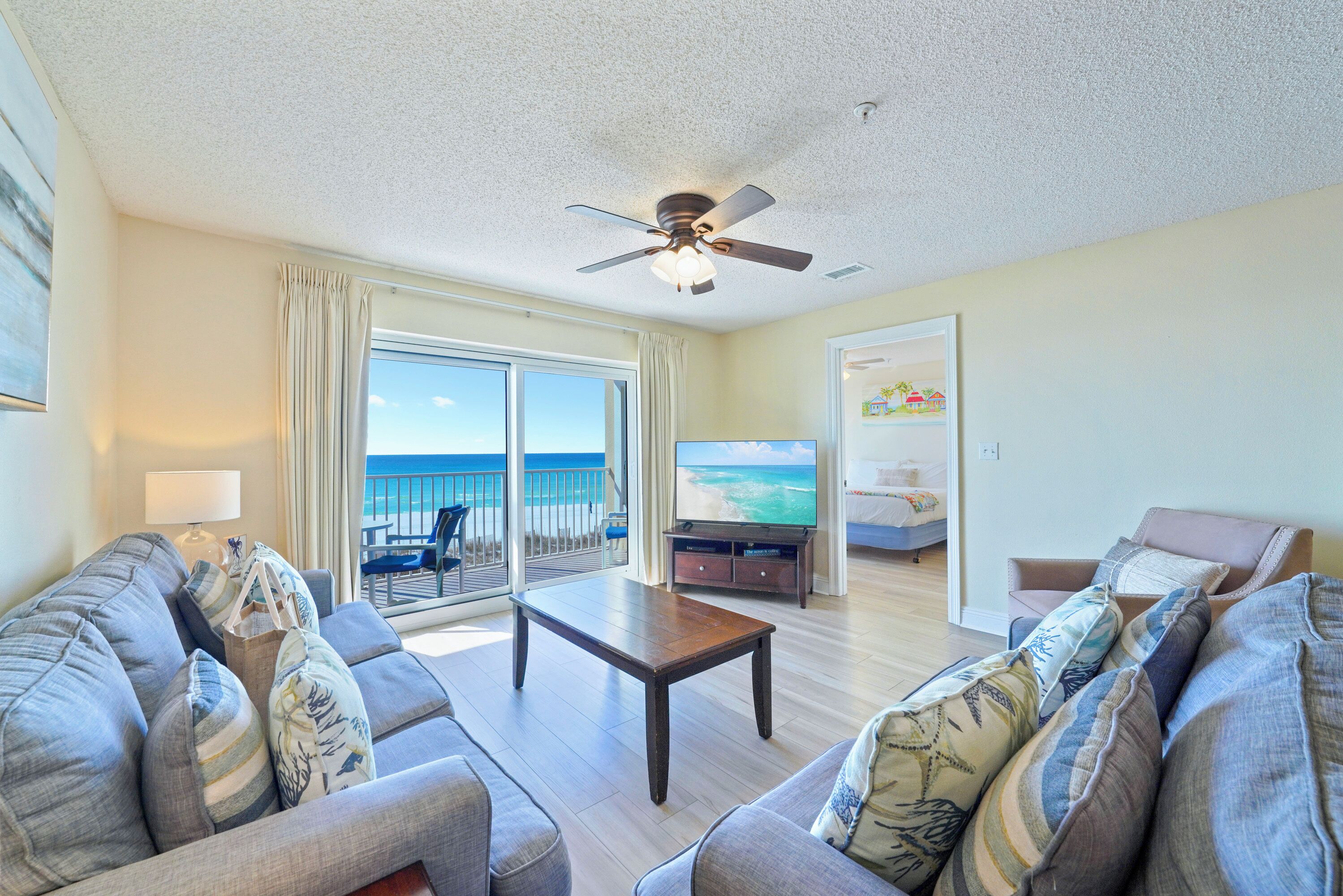 The open living room at Emerald Dunes 202 invites you to relax after a day on the sugar white sands of the Emerald Coast.