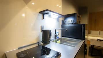 Fridge, microwave, cookware/dishes/utensils
