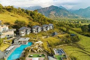 A resort with a swimming pool, multiple guest houses, terraced gardens, and mountainous views. - Norbu The Montanna, Dharamshala - Ihcl Seleqtions (Dharamshala)