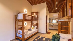 A bunk bed room with a wooden ceiling, a mirror, a sink, and a small rug. - Zo Selections Gokarna by Zostel (Gokarna)
