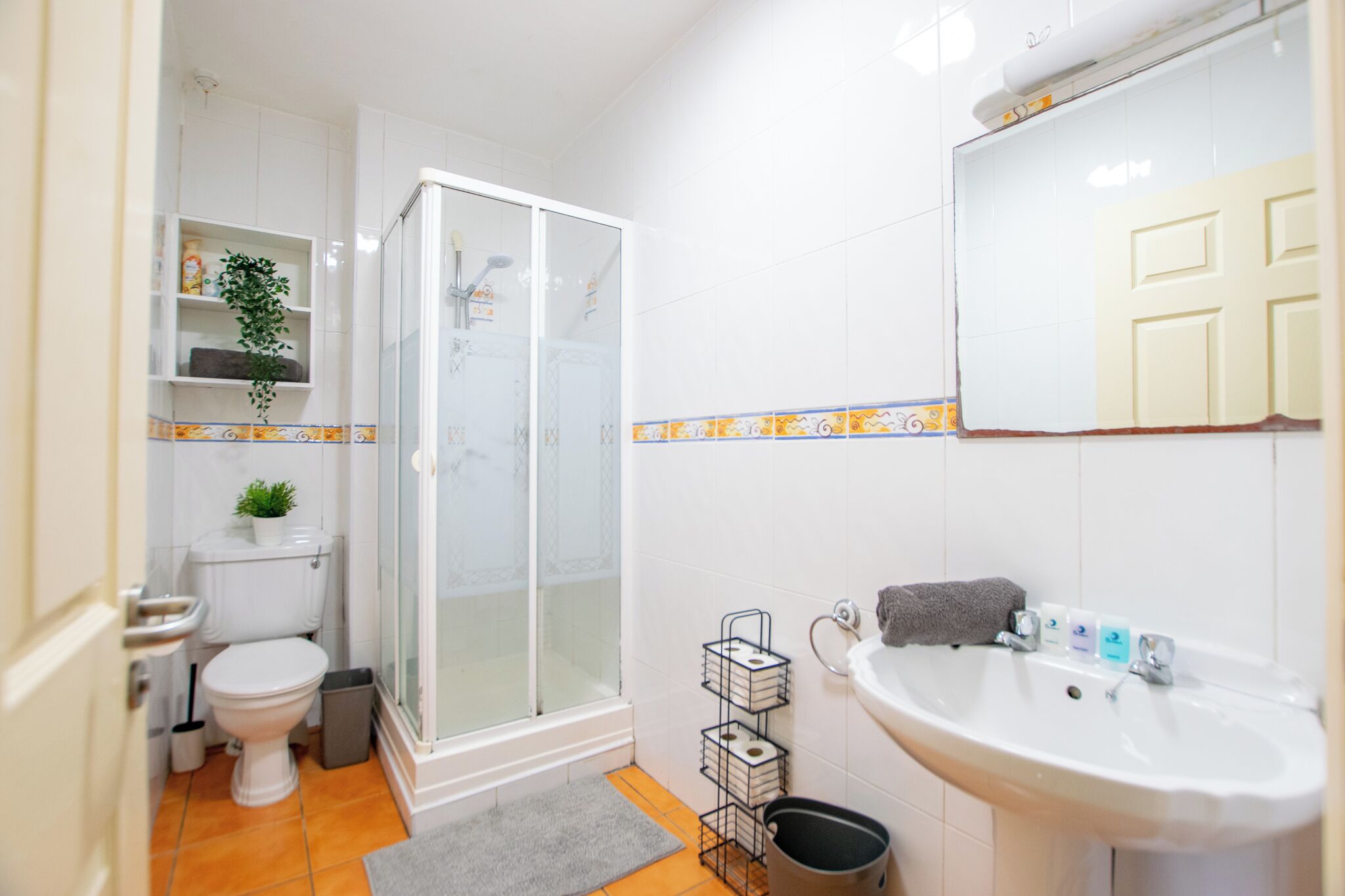 Shower, towels, soap, toilet paper