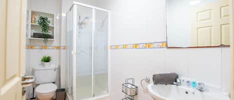 Shower, hair dryer, towels, soap