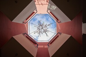 A view from a high vantage point looking down a geometric corridor with a central skylight. - Zen Zone Boutique Riad & Spa (Marrakech)