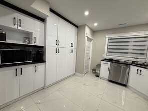 Coffee/tea maker, fridge, microwave, oven
