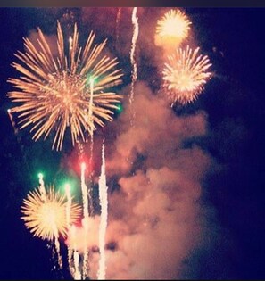 A night sky with fireworks. - Walk to Dollywood, fireworks view from your private hot tub!! (Pigeon Forge)
