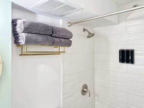 Shower, hair dryer, towels, shampoo