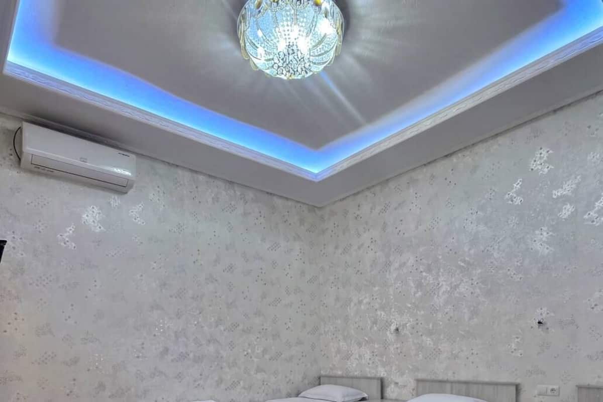 Deluxe Triple Room, Garden View | Laptop workspace, iron/ironing board, free WiFi